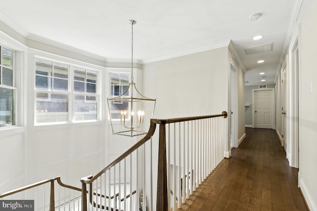6838 Saint Albans Rd, Mclean, VA 22101 - corridor featuring a chandelier, dark wood finished floors, recessed lighting, ornamental molding, and an upstairs landing