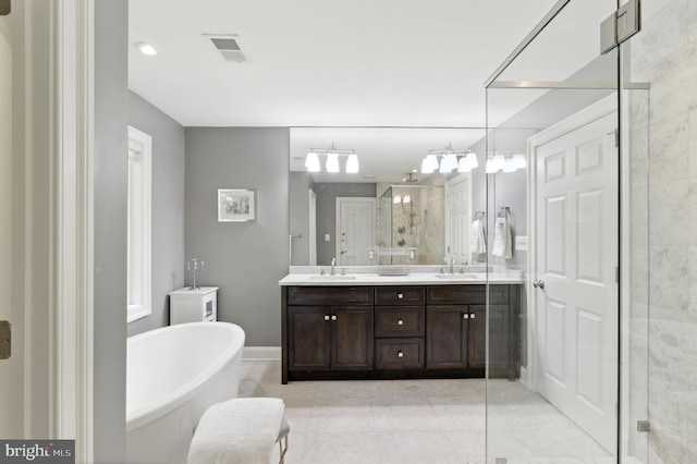 6838 Saint Albans Rd, Mclean, VA 22101 - full bath featuring a stall shower, double vanity, a freestanding bath, and tile patterned floors