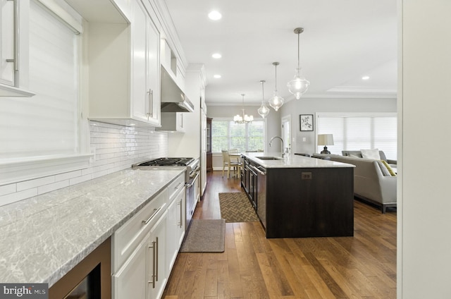6838 Saint Albans Rd, Mclean, VA 22101 - kitchen with range hood, white cabinets, dark wood-style floors, backsplash, and high end range