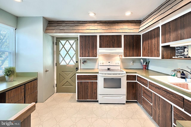 545 W King St, Littlestown, PA 17340 - kitchen featuring electric range, under cabinet range hood, light countertops, dark brown cabinetry, and recessed lighting