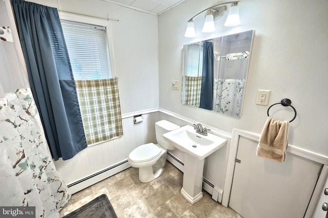 545 W King St, Littlestown, PA 17340 - full bath with a baseboard heating unit, a wainscoted wall, and a shower with curtain