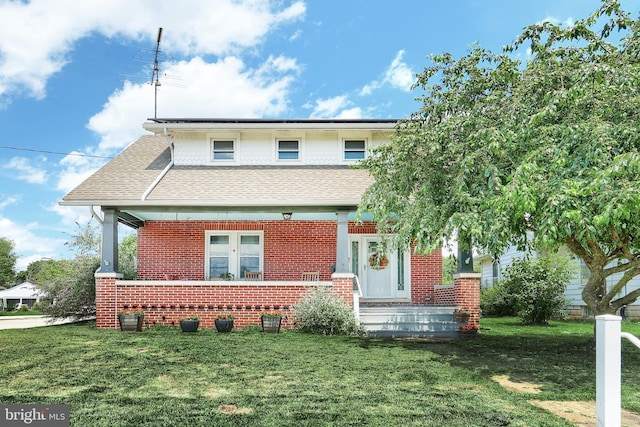 545 W King St, Littlestown, PA 17340 - view of front of property featuring brick siding, a front yard, and a shingled roof