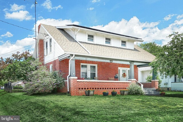 545 W King St, Littlestown, PA 17340 - view of front of property with a front yard, brick siding, and a shingled roof