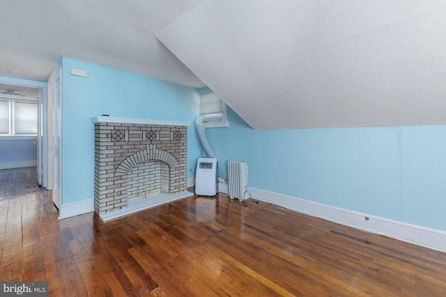 124 E Ormond Ave, Haddon Township, NJ 08107 - additional living space with radiator heating unit, lofted ceiling, hardwood / wood-style flooring, and a brick fireplace