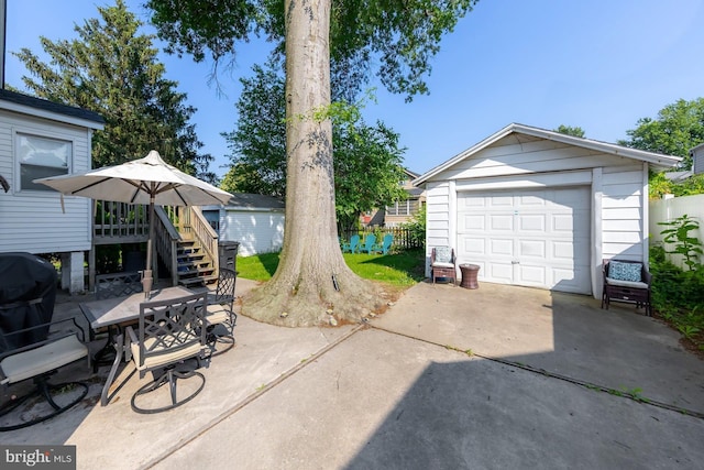 124 E Ormond Ave, Haddon Township, NJ 08107 - view of patio with concrete driveway, an outdoor structure, a detached garage, stairs, and grilling area