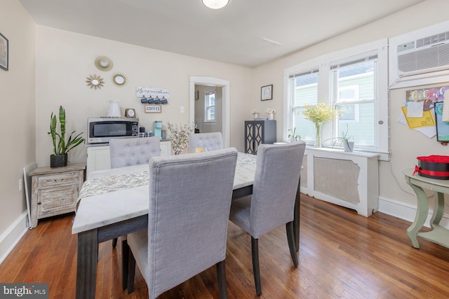 124 E Ormond Ave, Haddon Township, NJ 08107 - dining area with radiator heating unit, wood finished floors, and an AC wall unit