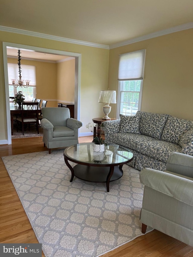 7 Camas Ct, Plainsboro, NJ 08536 - living room with healthy amount of natural light, crown molding, wood finished floors, and a chandelier