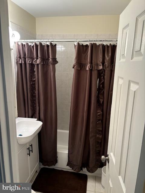 5755 E Capitol St SE, Washington, DC 20019 - bathroom with vanity, tile patterned floors, and shower / tub combo