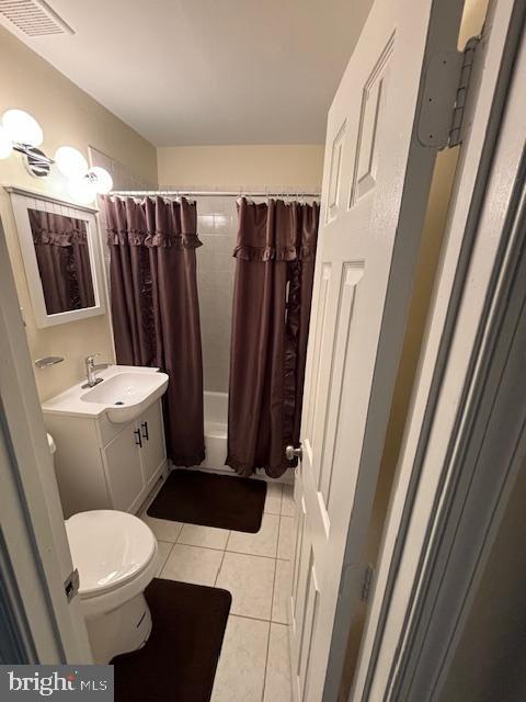 5755 E Capitol St SE, Washington, DC 20019 - full bathroom featuring tile patterned flooring, vanity, and shower / tub combo