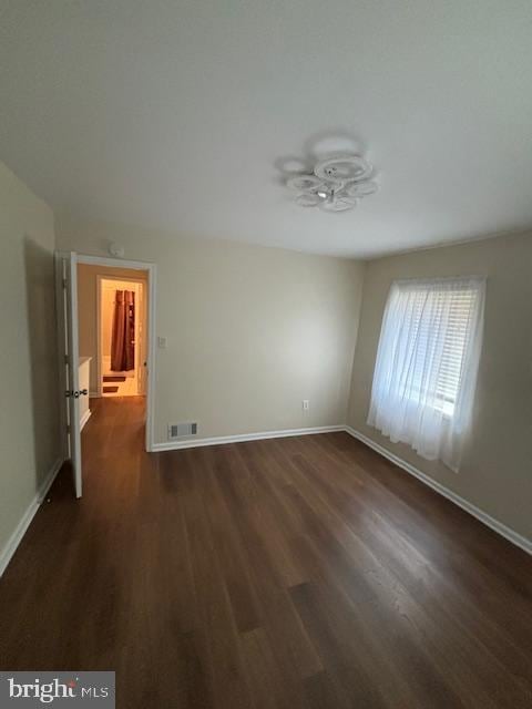 5755 E Capitol St SE, Washington, DC 20019 - empty room featuring dark wood-type flooring and a ceiling fan