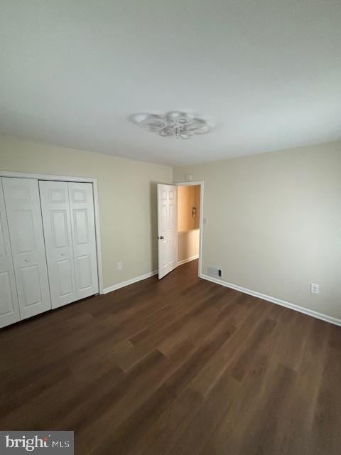5755 E Capitol St SE, Washington, DC 20019 - unfurnished bedroom featuring dark wood-type flooring and a closet