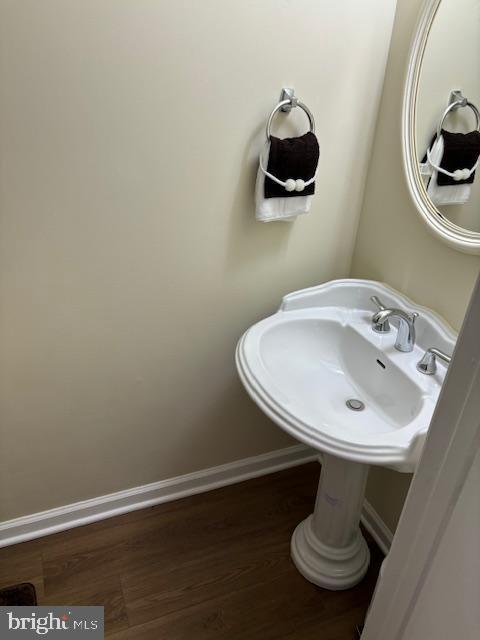 5755 E Capitol St SE, Washington, DC 20019 - bathroom with baseboards and wood finished floors