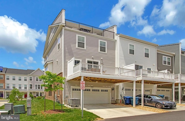 113 Treblis Way, Annapolis, MD 21403 - rear view of house featuring a garage, driveway, and a lawn