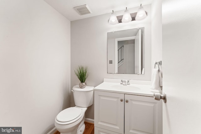 8573 Chester Grove Ct, Springfield, VA 22153 - half bathroom featuring vanity and wood finished floors