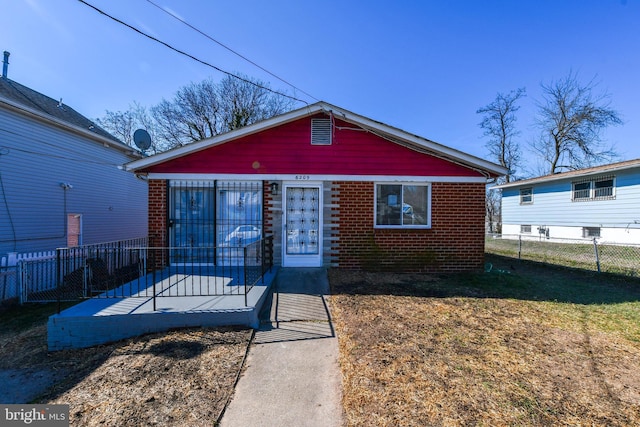 6209 Foote St, Capitol Heights, MD 20743 - bungalow-style home featuring a fenced backyard and brick siding