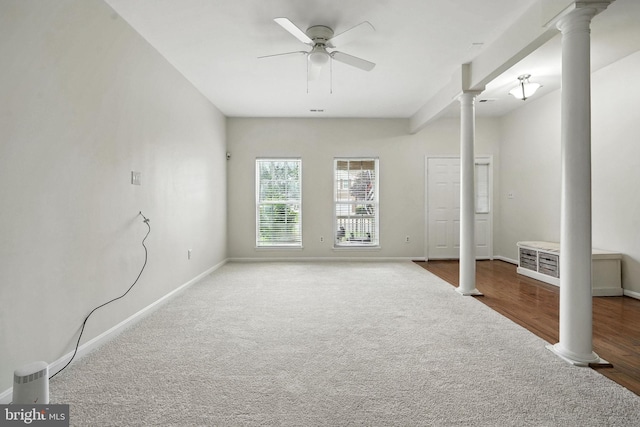 13297 Osage Dr, Woodbridge, VA 22193 - unfurnished living room with ornate columns, a ceiling fan, and carpet floors