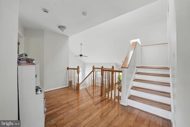 13297 Osage Dr, Woodbridge, VA 22193 - stairs with wood finished floors, a ceiling fan, and lofted ceiling