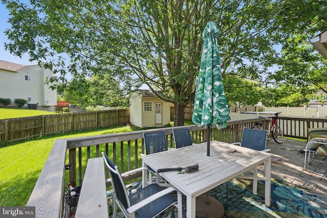 13297 Osage Dr, Woodbridge, VA 22193 - deck with a shed, a fenced backyard, and outdoor dining space