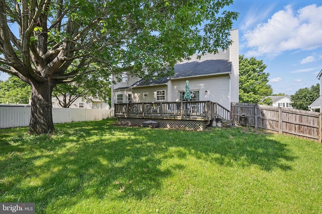 13297 Osage Dr, Woodbridge, VA 22193 - back of property featuring a fenced backyard, a wooden deck, and a chimney