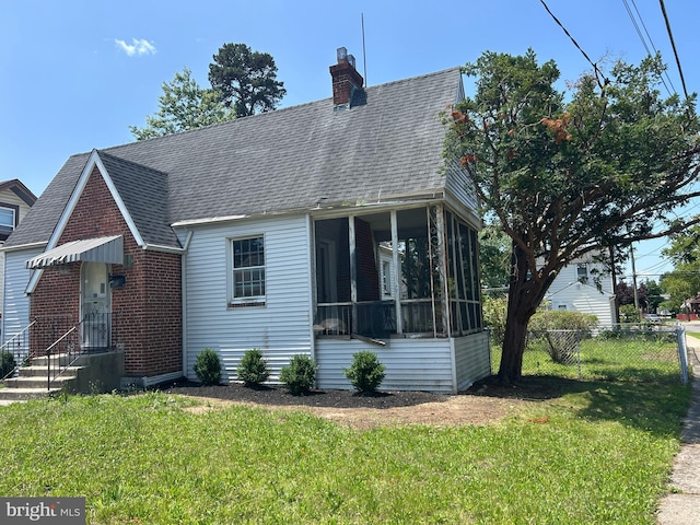 1903 Tinsman Ave, Pennsauken, NJ 08110 - view of front of home with a shingled roof, a sunroom, a chimney, and brick siding