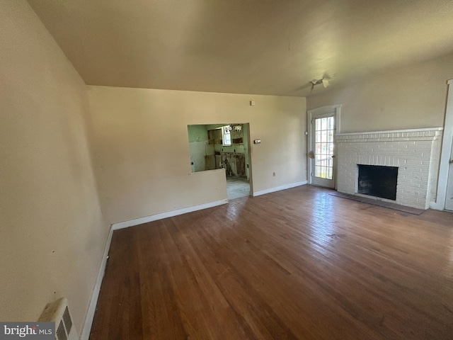 1903 Tinsman Ave, Pennsauken, NJ 08110 - unfurnished living room with wood finished floors and a fireplace