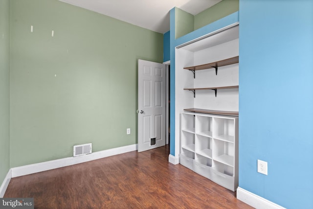 2528 E Somerset St, Philadelphia, PA 19134 - unfurnished bedroom featuring dark wood-style floors and baseboards