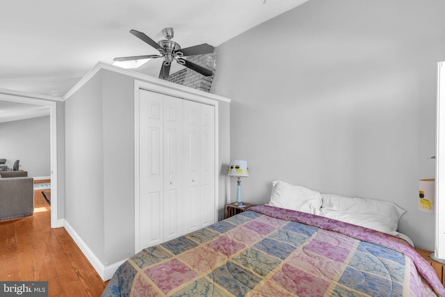 1243 Battery Ave, Baltimore, MD 21230 - bedroom featuring wood finished floors, a closet, and a ceiling fan
