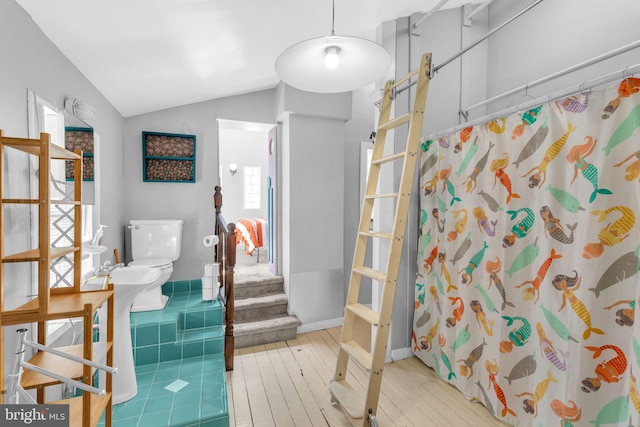1243 Battery Ave, Baltimore, MD 21230 - full bathroom with hardwood / wood-style flooring, a shower with curtain, and lofted ceiling