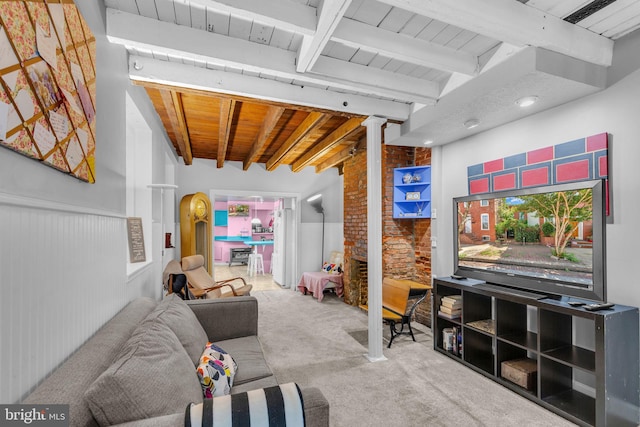 1243 Battery Ave, Baltimore, MD 21230 - carpeted living room with a wooden ceiling with exposed beams, a wainscoted wall, and decorative columns