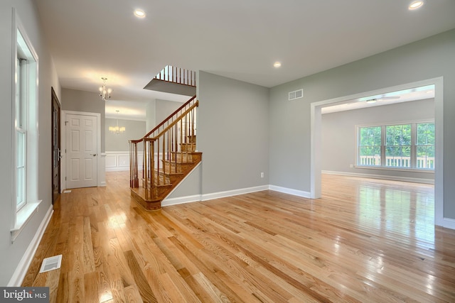 10905 Powers Ave, Cockeysville, MD 21030 - unfurnished room featuring a chandelier, light wood finished floors, stairway, and recessed lighting