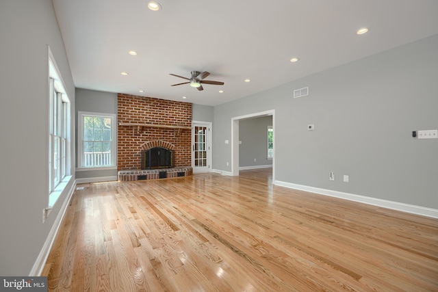 10905 Powers Ave, Cockeysville, MD 21030 - unfurnished living room with healthy amount of natural light, a ceiling fan, light wood-style flooring, recessed lighting, and a fireplace