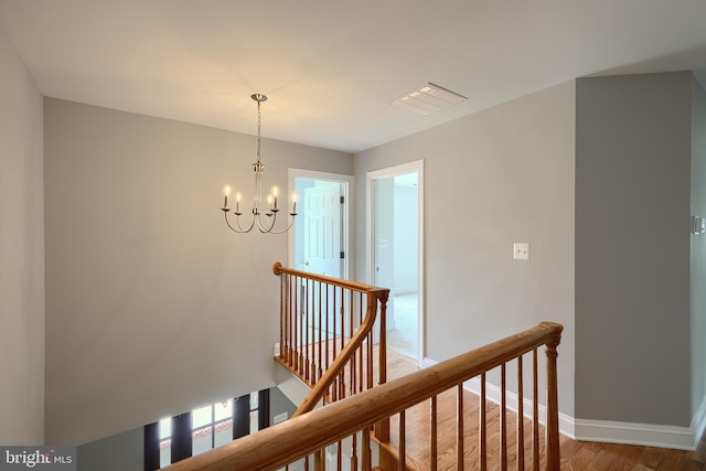 10905 Powers Ave, Cockeysville, MD 21030 - corridor featuring an upstairs landing, a chandelier, and wood finished floors