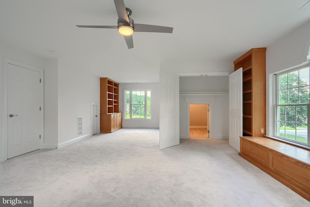 10905 Powers Ave, Cockeysville, MD 21030 - unfurnished bedroom with light colored carpet, multiple windows, a ceiling fan, and a closet