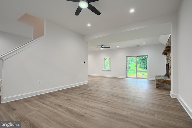 10905 Powers Ave, Cockeysville, MD 21030 - unfurnished living room featuring ceiling fan, wood finished floors, recessed lighting, and a stone fireplace