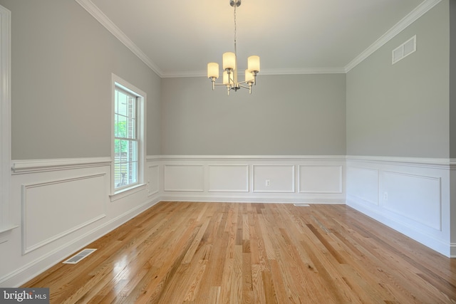 10905 Powers Ave, Cockeysville, MD 21030 - empty room featuring a chandelier, crown molding, light wood finished floors, a wainscoted wall, and a decorative wall