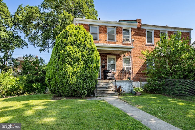 41161/2 Belle Ave, Baltimore, MD 21215 - townhome / multi-family property with brick siding, a porch, and cooling unit