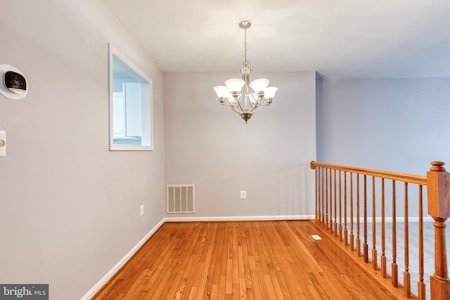 577 Francis Nicholson Way, Annapolis, MD 21401 - spare room featuring a chandelier and light wood finished floors