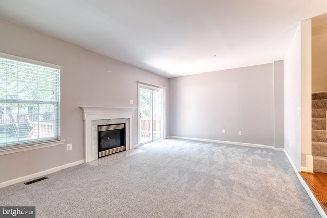 577 Francis Nicholson Way, Annapolis, MD 21401 - unfurnished living room with a premium fireplace, carpet, and stairway