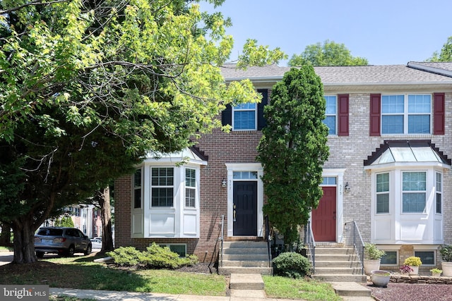 577 Francis Nicholson Way, Annapolis, MD 21401 - view of property featuring entry steps, brick siding, and a shingled roof
