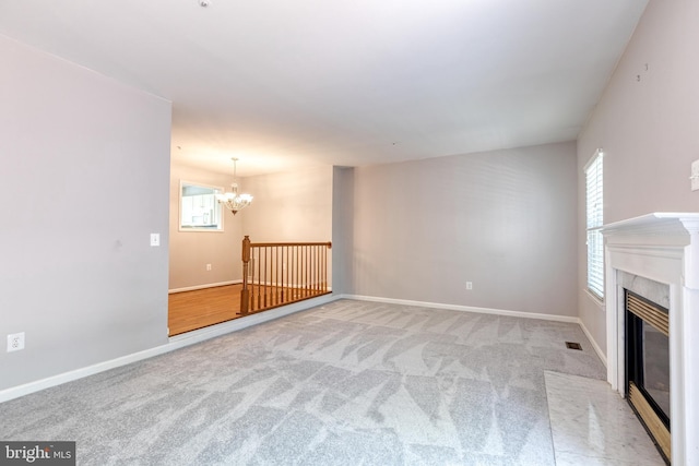 577 Francis Nicholson Way, Annapolis, MD 21401 - unfurnished living room featuring a chandelier, carpet, and a fireplace