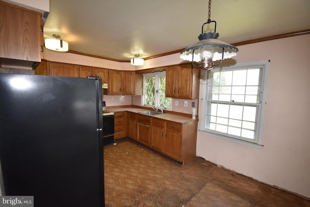 15 Sunset Rd, Willingboro, NJ 08046 - kitchen featuring freestanding refrigerator, electric range, brown cabinetry, ornamental molding, and decorative light fixtures