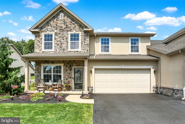 1283 Yarmouth Ln, New Cumberland, PA 17070 - view of front of property with stone siding, covered porch, stucco siding, driveway, and a front lawn