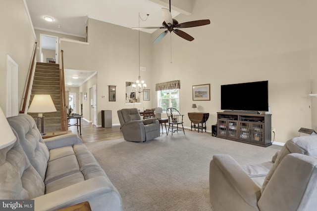 1283 Yarmouth Ln, New Cumberland, PA 17070 - living area with stairs, a ceiling fan, a chandelier, carpet floors, and high vaulted ceiling
