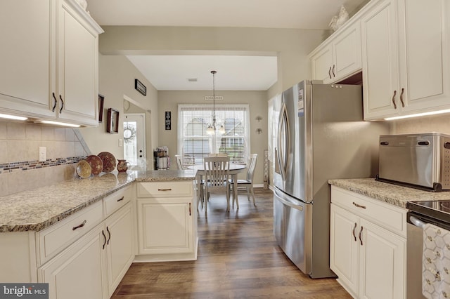 1283 Yarmouth Ln, New Cumberland, PA 17070 - kitchen with dark wood-type flooring, backsplash, range, freestanding refrigerator, and a chandelier