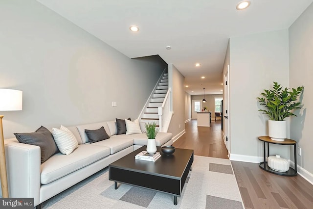 1508 N Eden St, Baltimore, MD 21213 - living area featuring wood finished floors, recessed lighting, and stairway