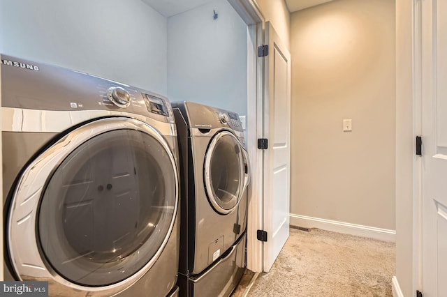 1508 N Eden St, Baltimore, MD 21213 - washroom with light carpet and washer and dryer