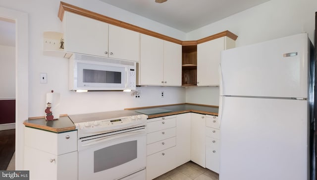 1081 Wynnwood Rd, Abington, PA 19001 - kitchen with white appliances, open shelves, white cabinetry, and dark countertops