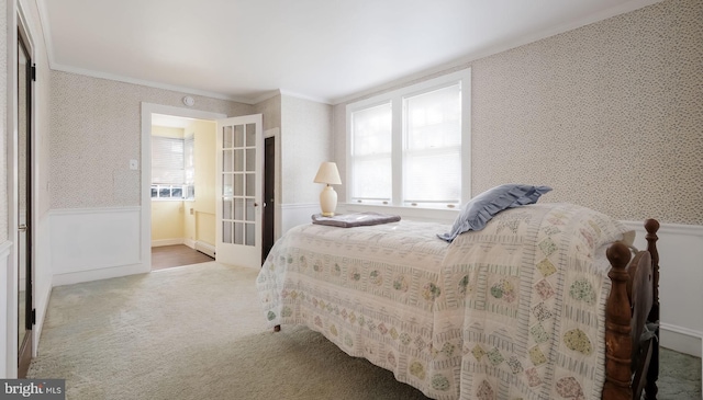 1081 Wynnwood Rd, Abington, PA 19001 - bedroom featuring crown molding, wallpapered walls, carpet floors, and a wainscoted wall