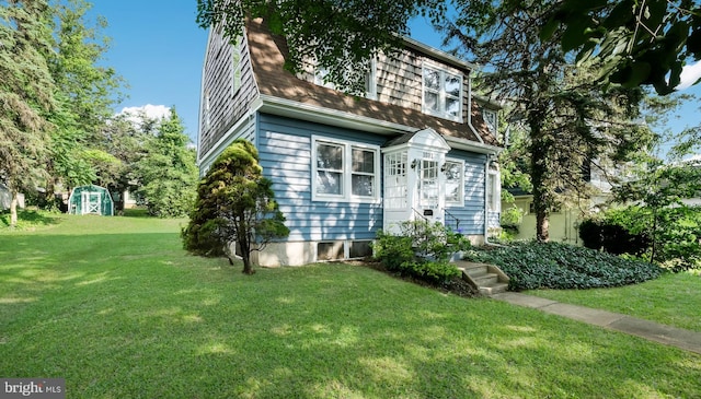 1081 Wynnwood Rd, Abington, PA 19001 - view of front of property featuring a front yard, a storage unit, and a shingled roof