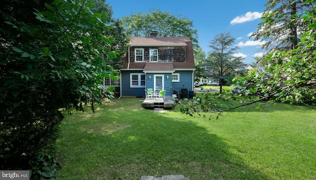 1081 Wynnwood Rd, Abington, PA 19001 - back of property featuring a deck, a yard, a chimney, and roof with shingles